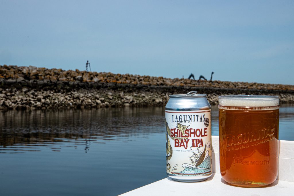 Lagunitas Brewing Company Seattle 12oz can Shilshole Bay IPA with mason on the river background