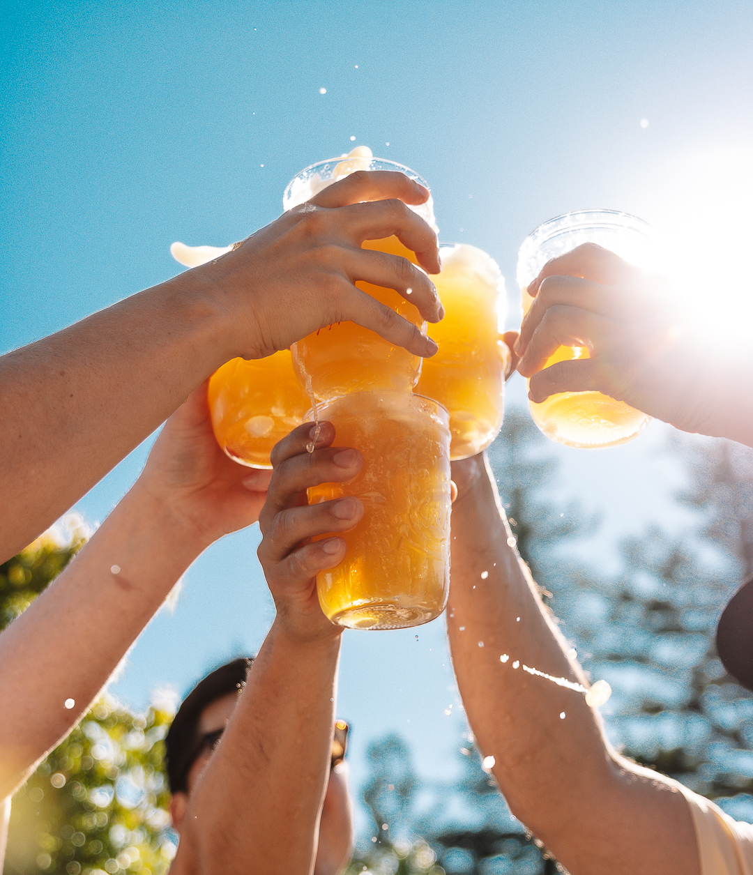 Group of people toasting with glasses of Hazy IPA